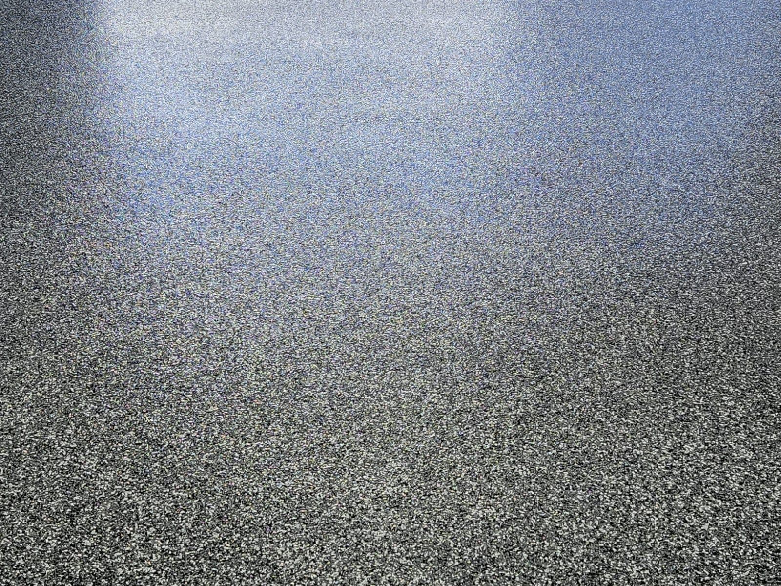 Dark flake epoxy floor in a garage interior